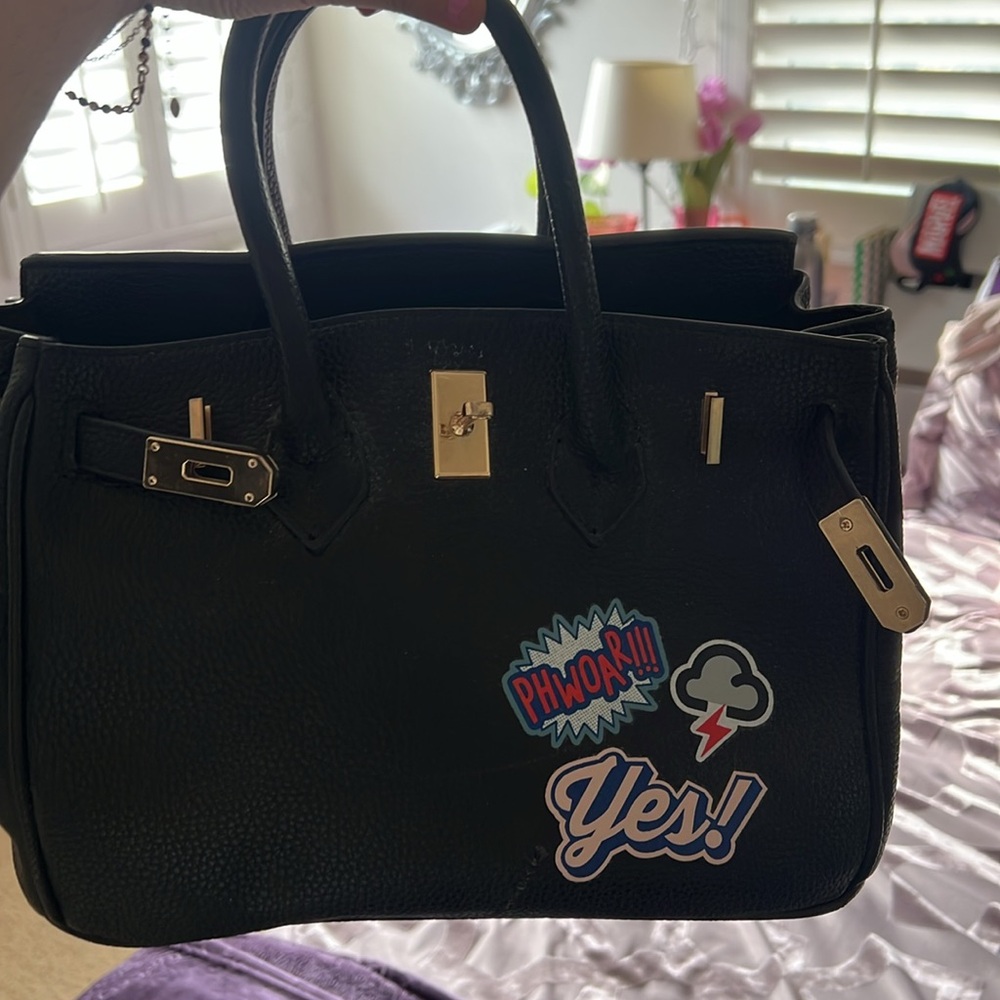 Black fashion bag with stickers,